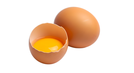 Brown chicken egg cracked open showing bright yellow yolk next to whole egg brown egg cracked egg