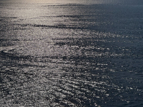 Sea twinkling surface at evening