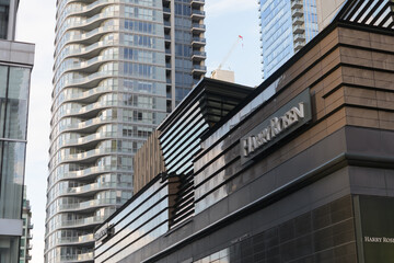 Fototapeta premium exterior building facade and sign of Harry Rosen, a men's clothing store, located at 82 Bloor St W, Toronto