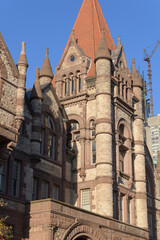 Fototapeta premium exterior of Victoria College, designed by William G Storm, in Richardsonian Romanesque, completed 1892, located at 73 Queen's Park Cres E, University of Toronto