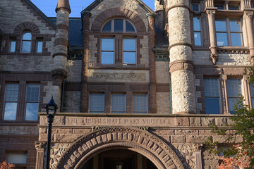 Fototapeta premium exterior of Victoria College, designed by William G Storm, in Richardsonian Romanesque, completed 1892, located at 73 Queen's Park Cres E, University of Toronto