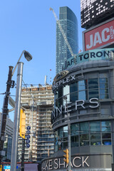 Fototapeta premium looking north from Sankofa Square to The Tenor, a shopping mall at 10 Dundas St E (location of Shake Shack, Winners, Cineplex, Jack's) to construction site, Toronto
