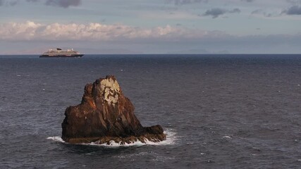 Tranquil coastal view with ferry in distance, Peaceful sea cliff with distant boat and soft evening hues calm scene