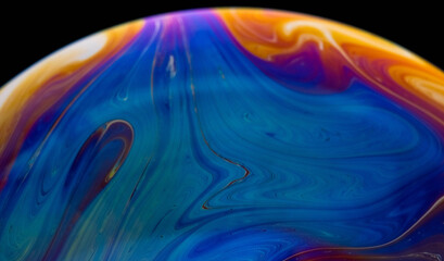Fototapeta premium closeup photo of colored light reflection on the surface of soap bubble