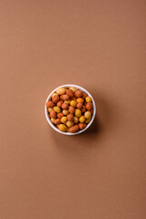 Food, nuts coated with salt and paprika, peanuts as a source of protein. Salted peanuts