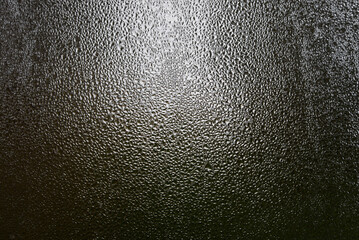 Close view of dark glass fogged up in damp weather