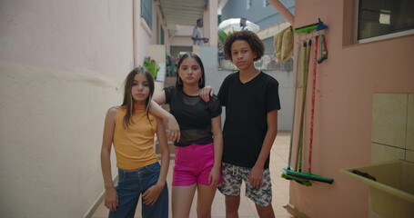 Teenagers posing with serious expressions in suburban alleyway, showing strength, resilience, and...