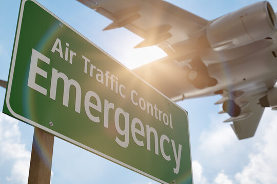 Air Traffic Control Emergency Green Road Sign with Airplane Above.