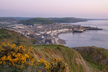 Fototapeta premium Sunset view of Aberystwyth from a nearby hill.