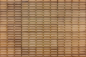 Geometric glass wall pattern in the Prague metro station with reflective golden and brown tones creating a modern design.