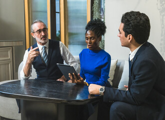 business meeting discussion among people seat around table modern office tablet on table convey collaboration communication relax working environment making suitable content related team office life.