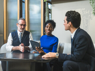 business meeting discussion among people seat around table modern office tablet on table convey collaboration communication relax working environment making suitable content related team office life.