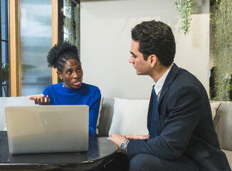 business meeting discussion among people seat around table modern office laptop on table convey collaboration communication relax working environment making suitable content related team office life.
