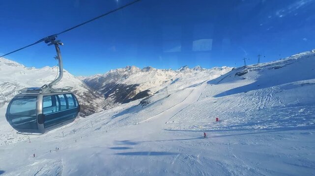 View from the mountain railway cabin over the ski areas around Zermatt, Switzerland