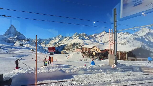 View from the moving mountain railway of the ski areas around Zermatt, Switzerland, with the Matterhorn peak in the background