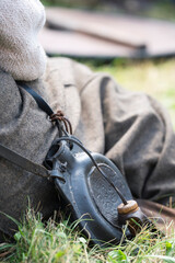 vintage leather water bottle worn over the shoulder