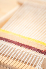 machine for spinning fabric from threads