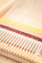 machine for spinning fabric from threads
