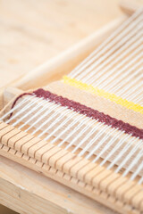 machine for spinning fabric from threads
