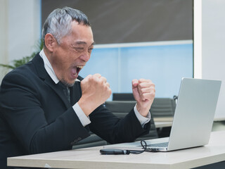 business man in suit analyzing charts and graphs on laptop screen in office setting. image show data visualization such as pie chart and bar graph, representing business analytics and decision-making.