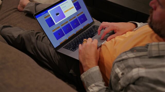 Man in White and Gray Flannel Shirt Online Shopping - E-Commerce Technology at Home Concept