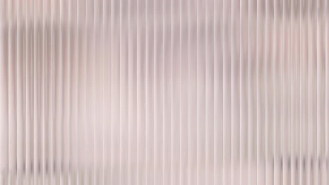 A close-up, abstract view of vertical ribbed texture with soft lighting.