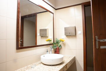 Modern white and brown Bathroom Interior with Sink, Mirror and white tiles