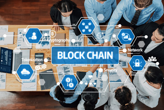 A diverse business team collaborates on blockchain technology, discussing strategies and innovations in a modern office, focusing on security and tokenization concepts. Amity