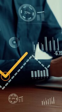 Businessman uses capable laptop computer to analyse business data analytic for marketing strategy and customer relationship management
