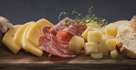 set of various meat and cheese snacks