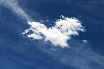 Minimalist sky scene with one cloud.