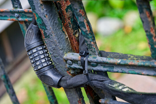 Metal fence with cable lock and code box for bicycle