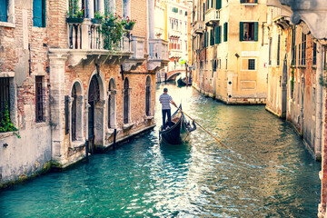 Gondola on a narrow canal in Venice, Italy