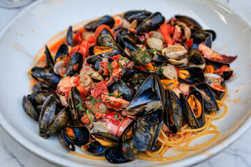 Seafood pasta with mussels, shrimp, clams and octopus, restaurant in Nice France