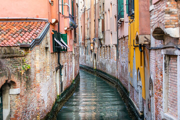 Venice - narrow canal and historic palaces, Italy