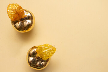 Golden Christmas ornaments on a colorful background