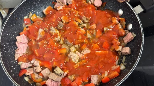 Preparing and Cooking of Tricolor Trottole Italian Pasta with Hearty Beef Ragu and Diced Cheese, Mediterranean Cuisine