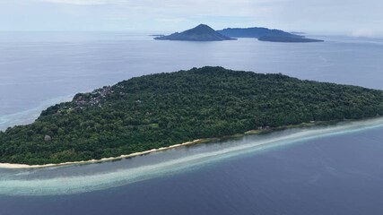 A beautiful coral reef fringes the island of Ai in the remote Banda Islands of Indonesia. This region is home to spectacular marine biodiversity and is a destination for divers and snorkelers.