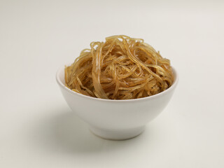 Stir fried glass noodles in white bowl