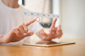 Businessman meticulously manages their daily schedule using a digital tablet with calendar application, representing schedule planning, appointment management, and time organization concept