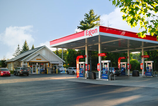 Latham, NY - Sep 18, 2025: Exxon gas station on Loudon Road in Latham, NY, featuring branded canopy, fuel pumps, and convenience store as part of regional service infrastructure