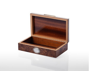 open and empty briar box, on a white background with reflection