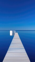 Wooden Pier Extending Into Calm Deep Blue Sea Under Clear Bright Sky With Minimalist White Structure At The End