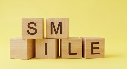 Wooden blocks spelling the word smile on a yellow background concept