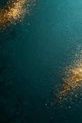 Fototapeta premium AI generated images. A structured dark green/blue background, with golden glitters and light.