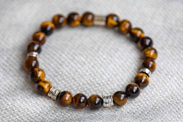 Wonderful men's bracelet made of tiger's eye stone with 925 silver. A semi-precious gemstone from the quartz group, with golden and brown tones and a silky sheen that resembles a tiger's eye.