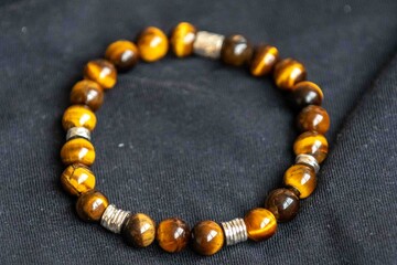 Wonderful men's bracelet made of tiger's eye stone with 925 silver. A semi-precious gemstone from the quartz group, with golden and brown tones and a silky sheen that resembles a tiger's eye.
