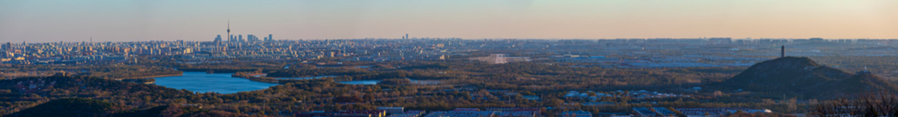 Aerial panorama of Beijing city and natural integration skyline at sunset, China