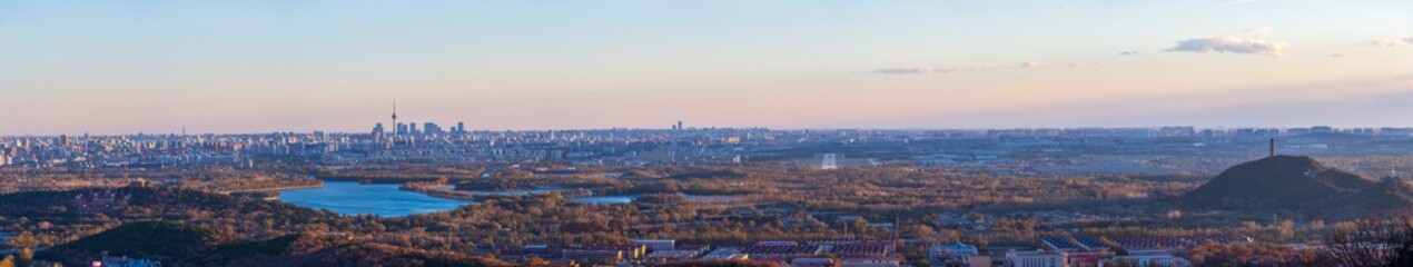 Obraz premium Aerial panorama of Beijing city and natural integration skyline at sunset, China