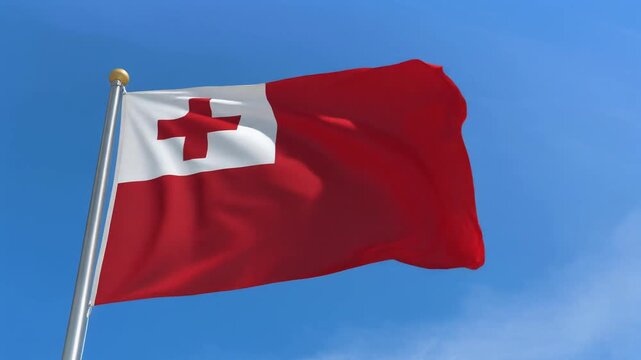 The vibrant red and white flag of the Kingdom of Tonga proudly waves in a gentle breeze against a bright blue sky, symbolizing national identity and freedom for the Pacific island nation